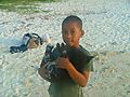 Young Mauritian Boy With Puppy